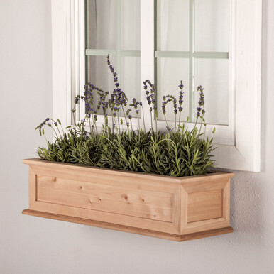 Framed Cottage Cedar Window Box mounted under a window 