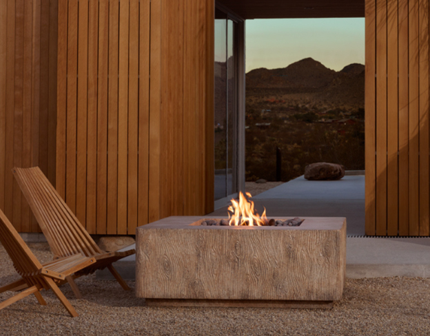 Basoa Fire Table with wood chairs  and desert scene behind
