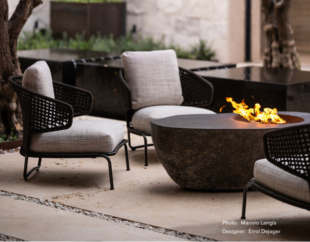 Boulder Fire Bowl with flames and some low profile chairs